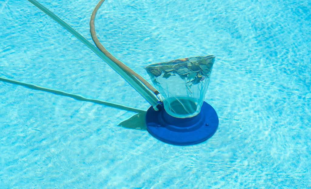 Vacuuming the Pool Bottom of swimming pool